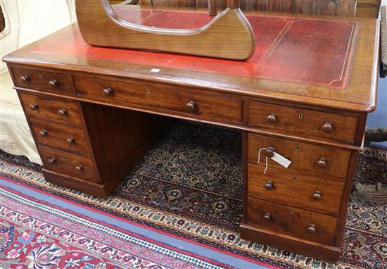 An Edwardian mahogany partners desk W.152cm